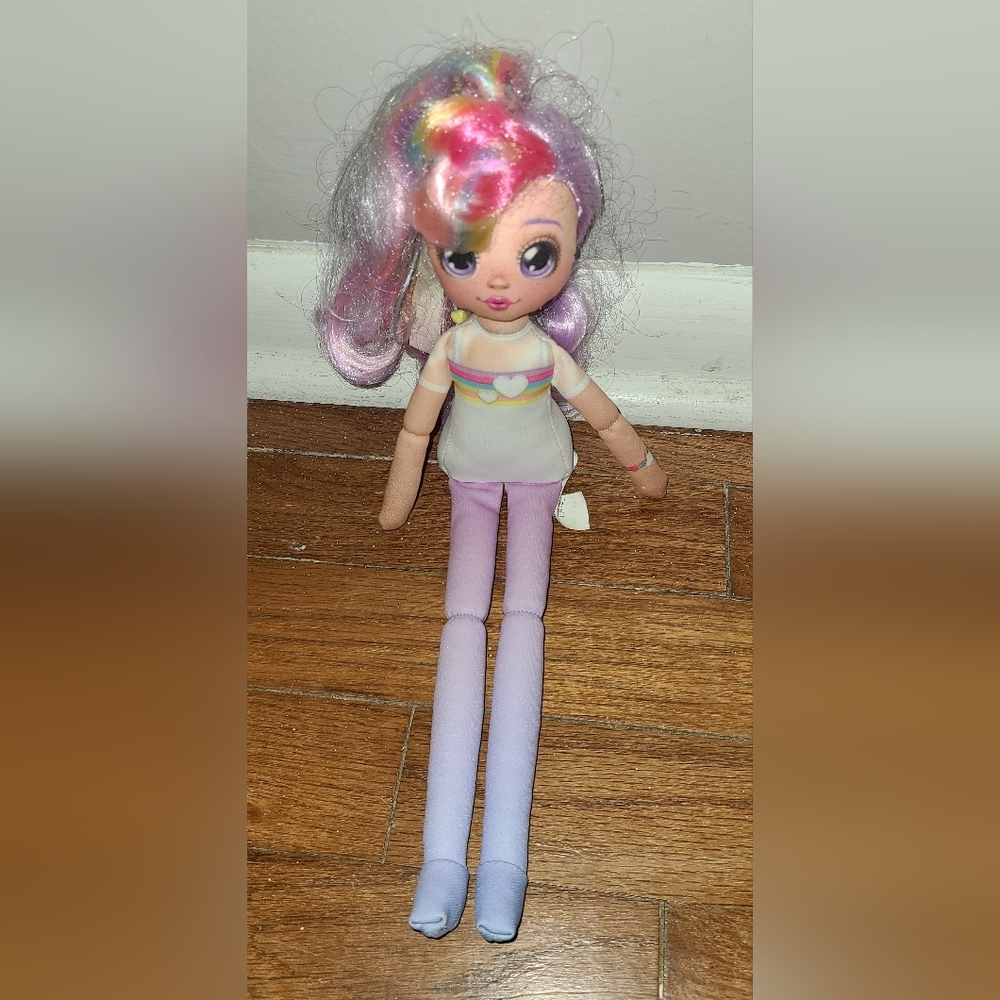 Doll from the Moose group with rainbow hair